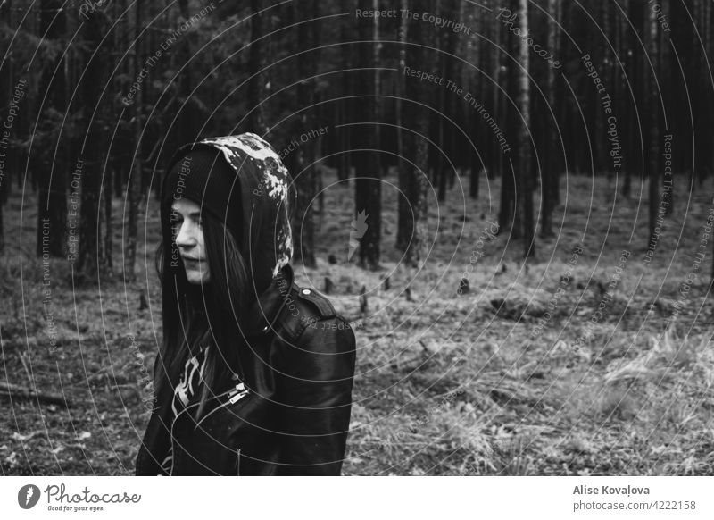 a walk in the forest in black and white girl portrait trees pines Nature Black and white photography leather jacket walking hoodie dark Hair