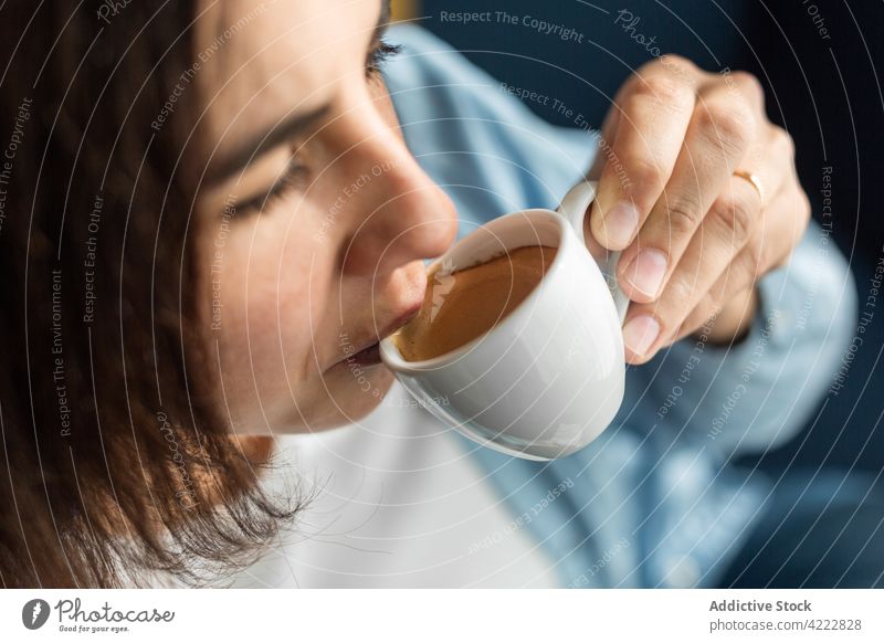 Woman drinking coffee from small cup at home woman espresso aroma beverage brew enjoy female pregnant pregnancy harmony calm tender tranquil caffeine hot drink