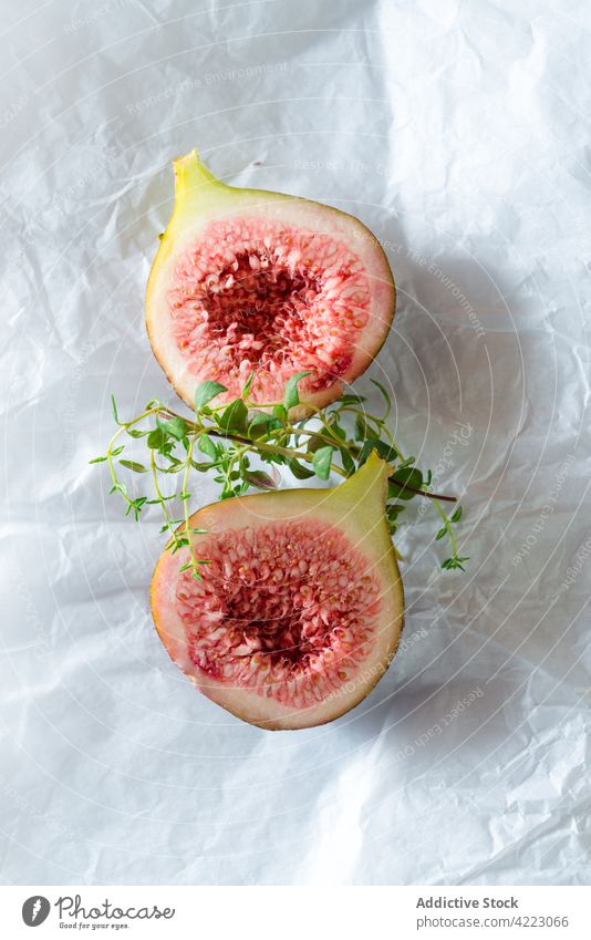 Delicious fresh figs with thyme on brown background fruit healthy food natural ingredient tasty sweet vitamin herb juicy ripe pulp whole cut organic piece