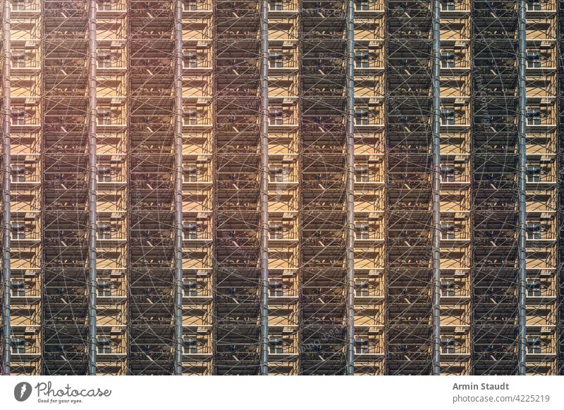 architecture pattern, berlin facade with construction site scaffolding industry frame workplace framework seamless repetition big huge anonymous house rent