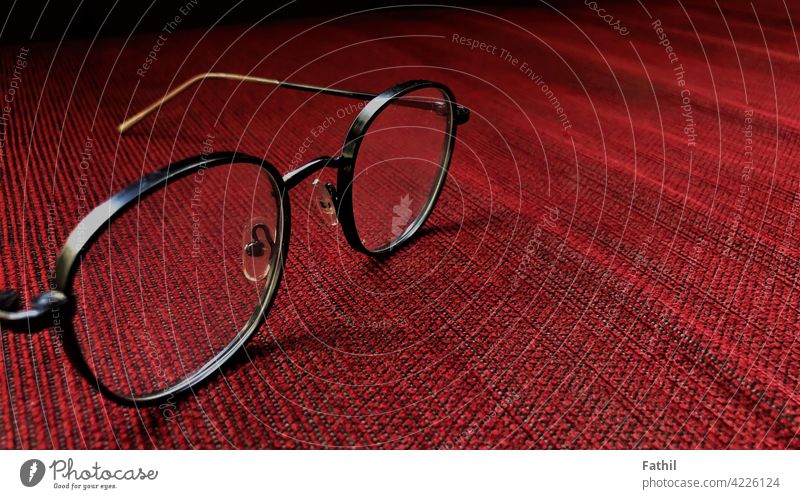 Glasses on red sofa in the Hotel glass focus texture background line vintage cool object