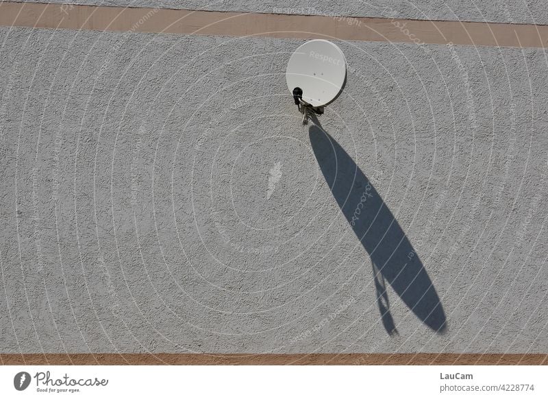 Small satellite dish with big shadow play Satellite Dish Shadow Shadow play Facade house facade Sun Sunlight shadow cast Large communication television Receive