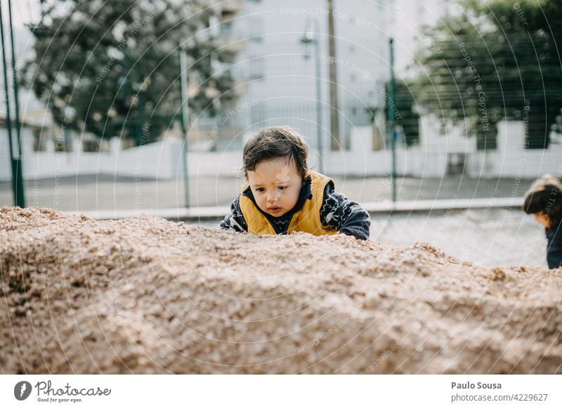 Child climbing sand childhood Sand Authentic Adventure Playing Childhood memory Infancy Life Toddler Lifestyle Joy Human being Colour photo 1 - 3 years Emotions