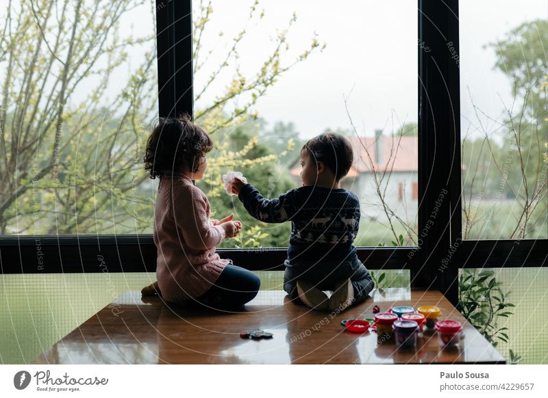 Brother and sister playing Brothers and sisters Family & Relations Child 1 - 3 years Caucasian Together togetherness Authentic Window rainy Human being Playing