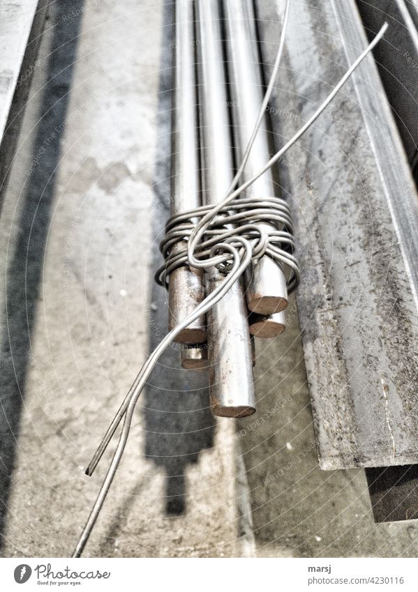 Steel rods, tied together with iron wire and artfully decorated. Industry Industrial Photography Arranged flexed Subdued colour crimped Wire Clarity passing