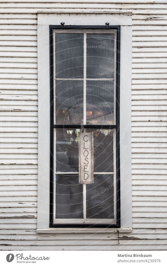 Old store window with a closed sign in a window in Texas texas antique grunge business shop glass hanging vintage banner retro old text design retail symbol