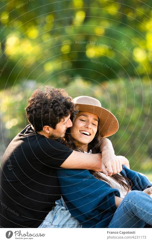 young couple loving each other in the park beautiful boyfriend casual cheerful day family female fun happiness happy laughing leisure lifestyle love man nature