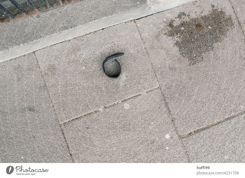 lonely collar with wet spot on sidewalk - where is the dog Loop Neckband wet stone Patch bequest Run away run away fled Stone Gray Dirty Concrete Old