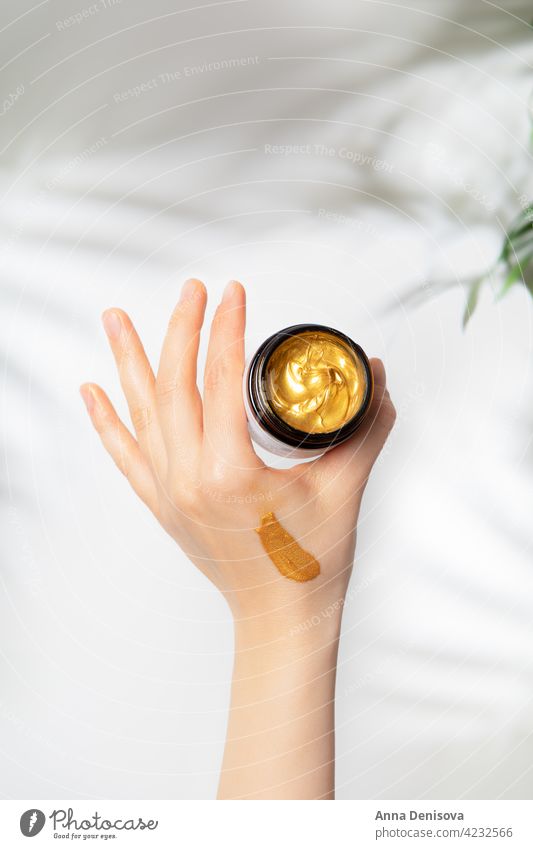 Trendy Gold face mask in jar golden trendy cream cosmetic skincare oil liquid serum organic treatment facial female glass container beauty natural product spa