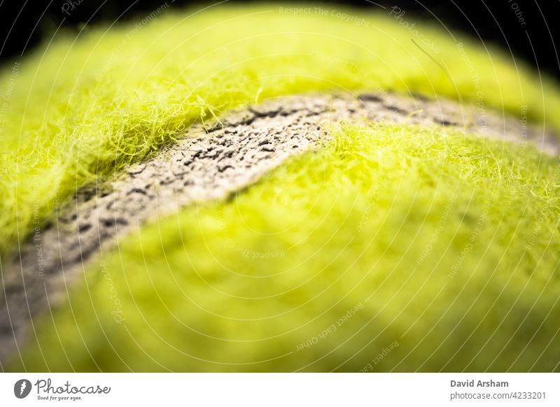 Extreme Closeup of Horizontal Tennis Ball Seam tennis ball optic yellow sports macro equipment isolated felt green closeup game recreational bright round energy