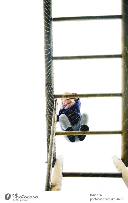 Child climbing on a climbing frame Climbing Playground courageous Girl Infancy Playing Brave Tall climbing gear out
