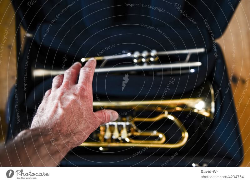 Discipline and ambition - musician with instrument Hand Musician discipline Musical instrument Trumpet diligence Ambitious Preparation Grasp self-study