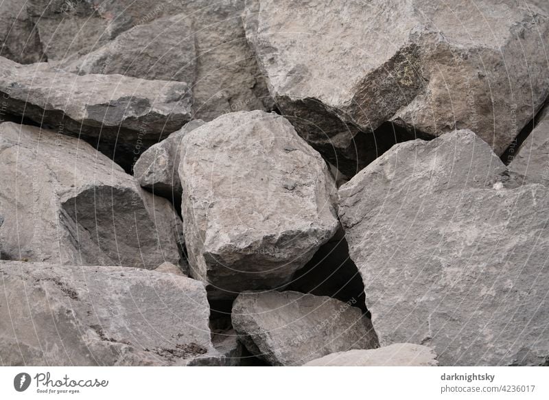 Large quarry stones from a quarry lie in a heap Large quarry stones in a heap Deserted Nature Exterior shot Landscape Rock Construction site raw materials