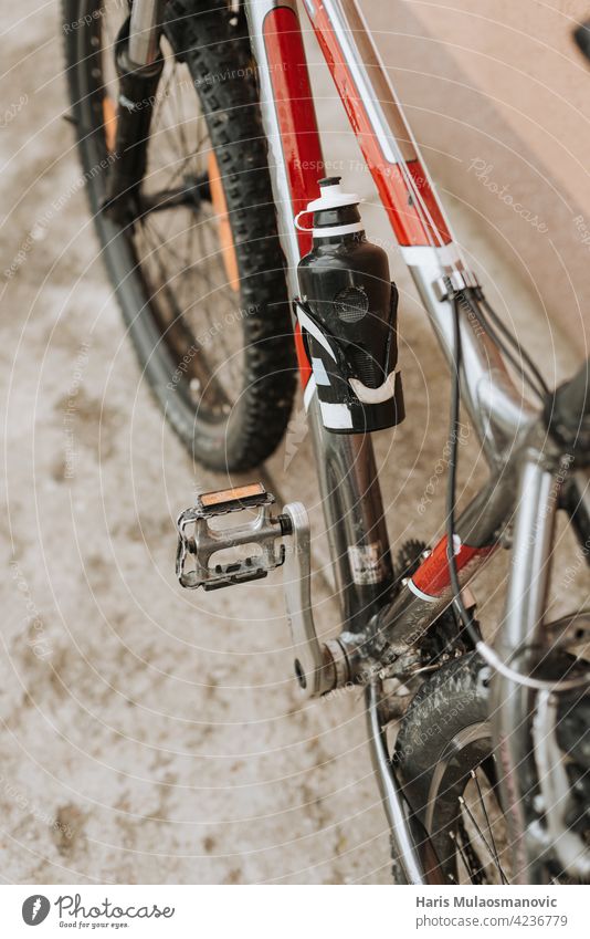 dirty bicycle with water bottle background bike biking black business chain closeup cyclist equipment gear industrial industry lifestyle looking maintenance man
