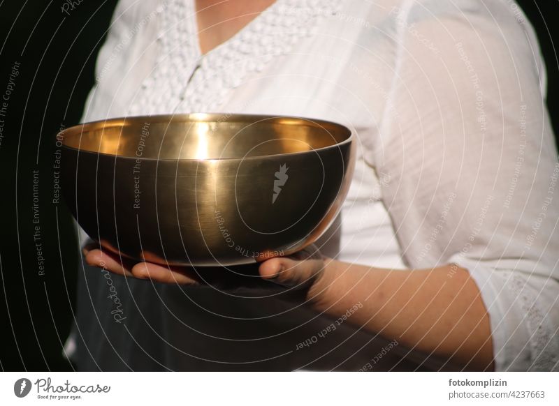 female hand carries a singing bowl Sound Meditation Relaxation Bowl Calm Healthy Wellness Well-being Senses Attentive Woman Balance Vigor Comforting