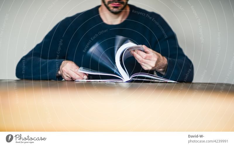 Man leafing through a book Book To leaf (through a book) lookup Reading Education Study Table Sit Anonymous book pages Know