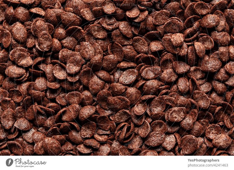 Chocolate cornflakes cereal, background, top view. Breakfast cereals close-up, full-frame above view abundance backdrop breakfast brown childhood chocolate