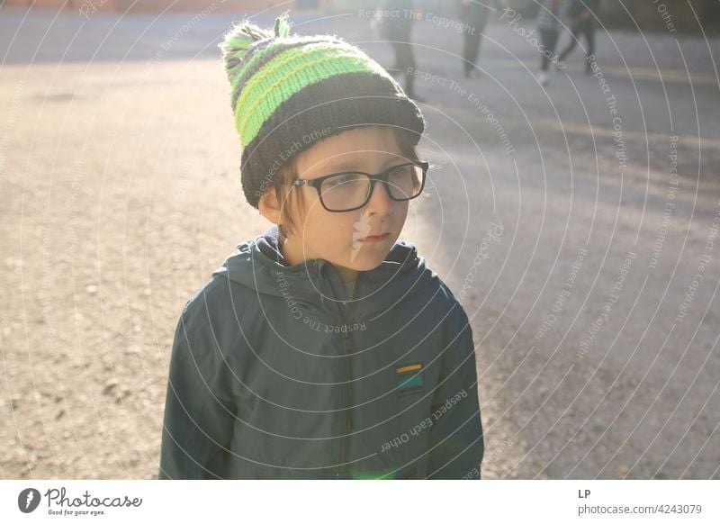 portrait of a child wearing a hat and glasses difficulties empathy challenge Complex need soothing Behavior coping with social distancing Well-being Stress