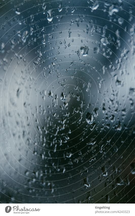 Raindrops on the window pane raindrops Bad weather Dark Thunder and lightning Gale Slice Window Drop background Metal metallic Blue somber Perspiration