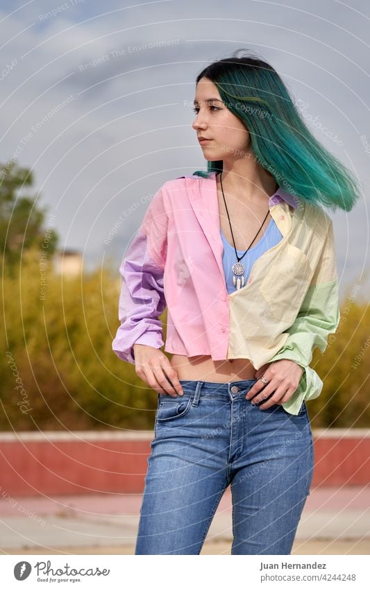 young girl with turquoise hair standing looking away caucasian pensive thinking expression one person emotion lonely relax relaxation emotional ethnicity woman