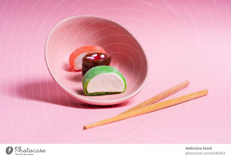 Yummy candy sushi served on pink plate with chopsticks sweet dessert asian food meal delicious yummy tradition japanese cuisine tasty gourmet dish oriental