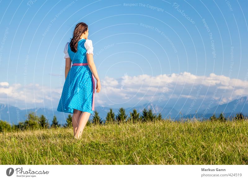 Woman in Bavarian costume Lifestyle Summer Oktoberfest Human being Feminine Adults 1 18 - 30 years Youth (Young adults) Nature Landscape Sky Beautiful weather
