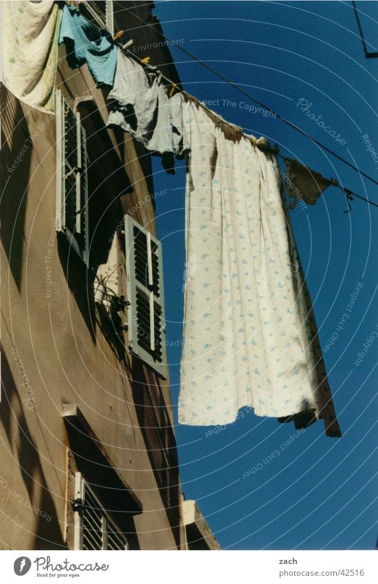 Clothes line compulsion Colour photo Exterior shot Deserted Day Worm's-eye view Exotic Living or residing House (Residential Structure) Rope Sky Corfu Greece