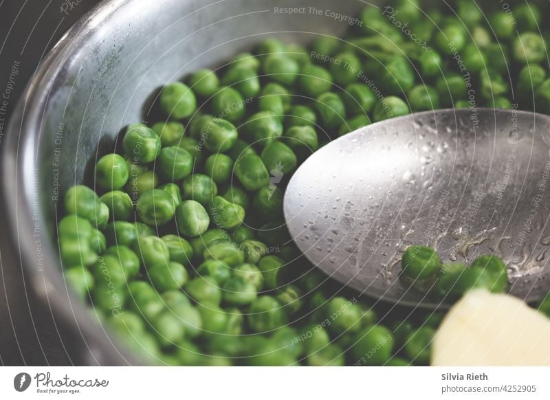 Peas in a sauté pan with a spoon and a knob of butter. Vegetable Food Green Nutrition Organic produce Eating Vegetarian diet Lunch Dinner Delicious