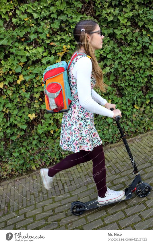on the way to school Schoolchild Class Girl Schoolgirls teenager Schoolbag High School Education pupil Satchel scooter plaits Lanes & trails Summer dress Ivy
