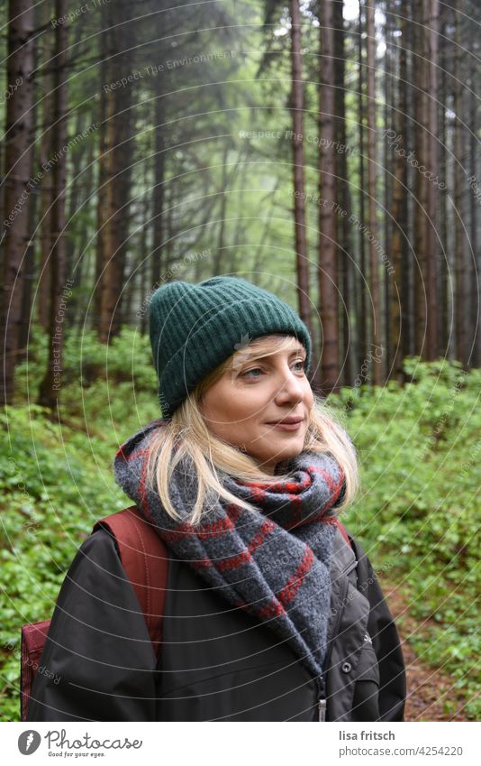 NATURE - FOREST - IDYLL Woman Blonde 30-34 years Cap Green Nature Forest trees Colour photo Adults Exterior shot naturally Hiking Leisure and hobbies Relaxation