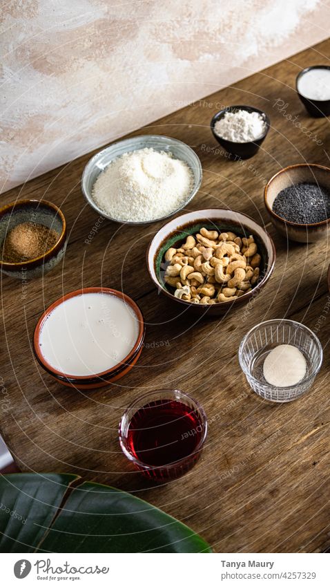 ingredients lined up for a vegan pastry recipe wooden background top view various food frame glass healthy pastry ingredient rustic food and drink
