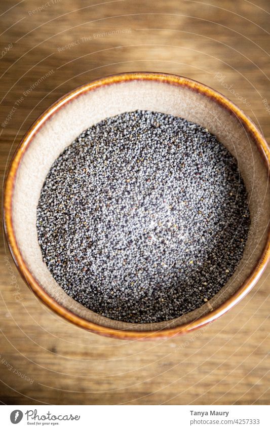 bowl of poppy seeds on a wooden table Dry Dried Plant poppy seed capsules Poppy appetizing homemade Seed Eaten Cooking Healthy Seeds Ingredients ingredient