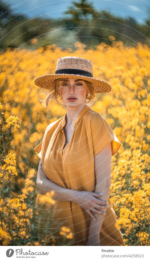 Woman with straw hat in rape field Straw hat Canola Canola field Oilseed rape flower Yellow Summer Freckles beauty in nature Beauty & Beauty Nature Plant