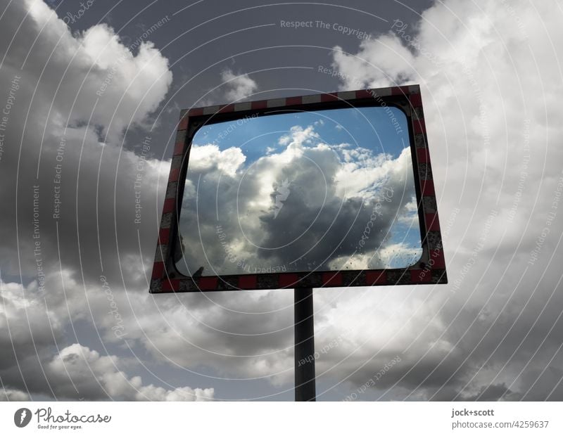 Sky, clouds around and in a traffic mirror Reflection traffic mirrors Abstract Safety Far-off places Convex Design Moody Road safety Mirror