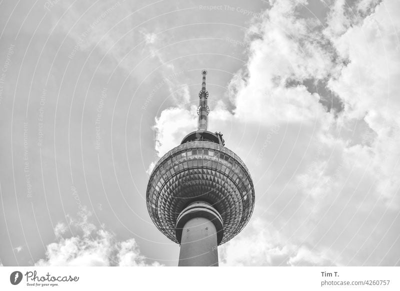 the television tower from below Television tower Berlin Middle b/w Sky Clouds Capital city Downtown Town Exterior shot Architecture Deserted Manmade structures