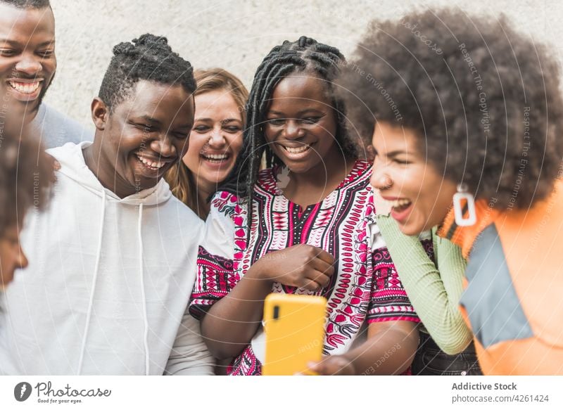 Happy multiethnic friends taking selfie on smartphone in town memory moment smile street using gadget women device cellphone self portrait content glad