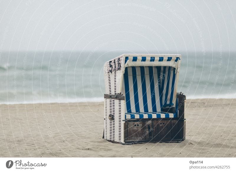 beach chair Beach chair Ocean Sylt Island vacation tranquillity relaxation Sit Water sea seascape Sea water coast Sand Blue Wind windy Gale Rough Nature North