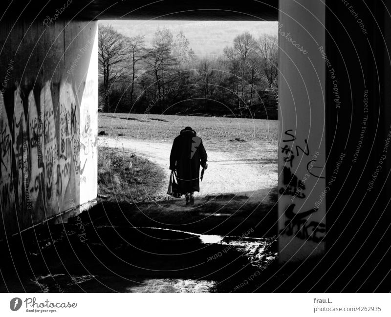 forebodings - return Photomontage on one's own Human being Lonely Loneliness Degersen Handbag Crooked Coat Hat Going off the beaten track Woman Village Bridge