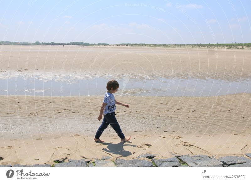 boy walking on the beach lonely Think Infancy Concern solitude pensive people abuse Expression Pain Fatigue Abstract Human being Exterior shot Education