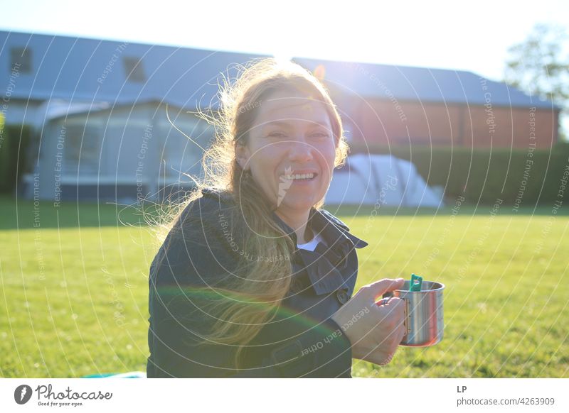 happy beautiful young woman laughing and holding a cup Upper body Portrait photograph Exterior shot Multicoloured Style Calm Joie de vivre (Vitality) Emotions