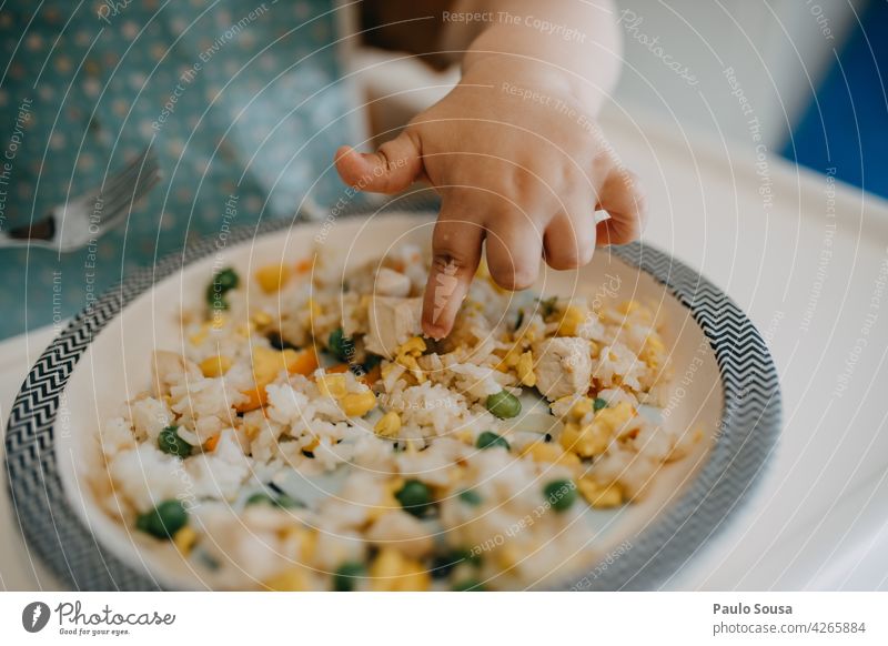 Child eating with hands childhood Curiosity Eating Food people boy Colour photo Nutrition Infancy food kid fun happy caucasian Lifestyle young Human being