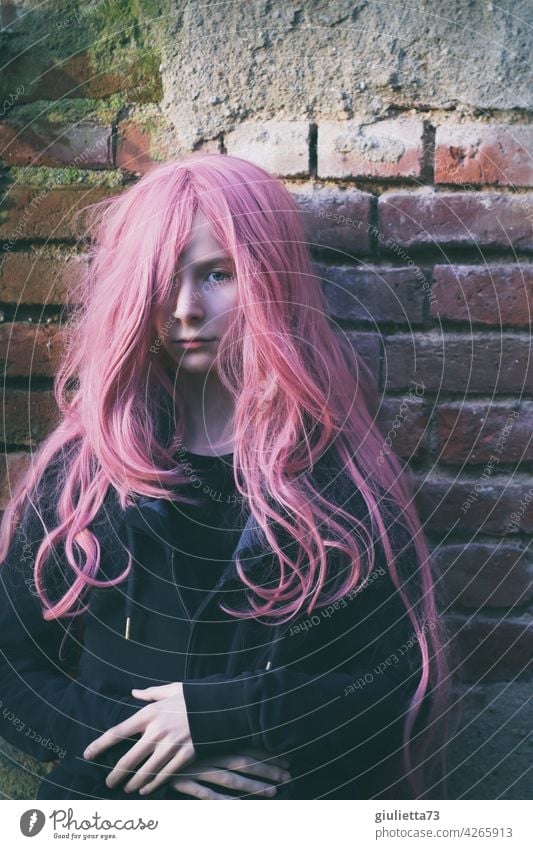 Portrait of a teenage girl with long pink hair Rebellious differently Invisible Mistrust Doubt Half-profile Inspiration Dream Meditative Life Punk Crazy Pink