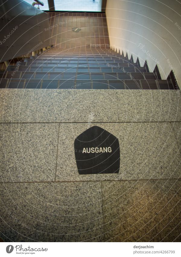 Tiled staircase in a beautiful brown tone. At the bottom of the stairs is written in German : AUSGANG Stairs ingots Staircase (Hallway) Architecture Downward