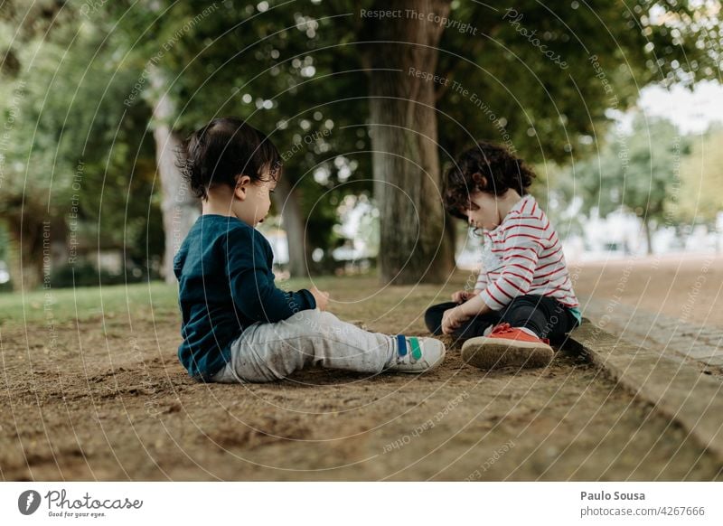 Brother and sister playing outdoors Brothers and sisters Park Playing Day Together Child Infancy Joy Colour photo Human being Exterior shot Friendship 2 Girl