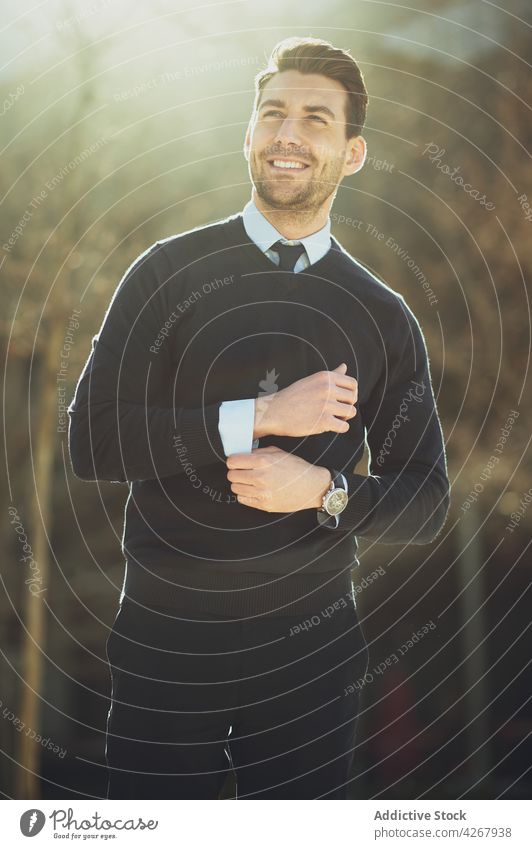 Cheerful businessman in formal apparel on city street entrepreneur style fashion individuality gentleman cheerful wristwatch haircut lifestyle town well dressed