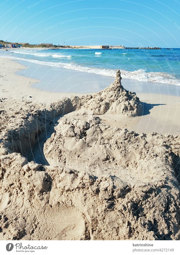 Sand castle on Penna Grossa beach, Torre Guaceto sandcastle summer coastline adriatic sea apulia blue sky cliff cristal water europe italy puglia salento