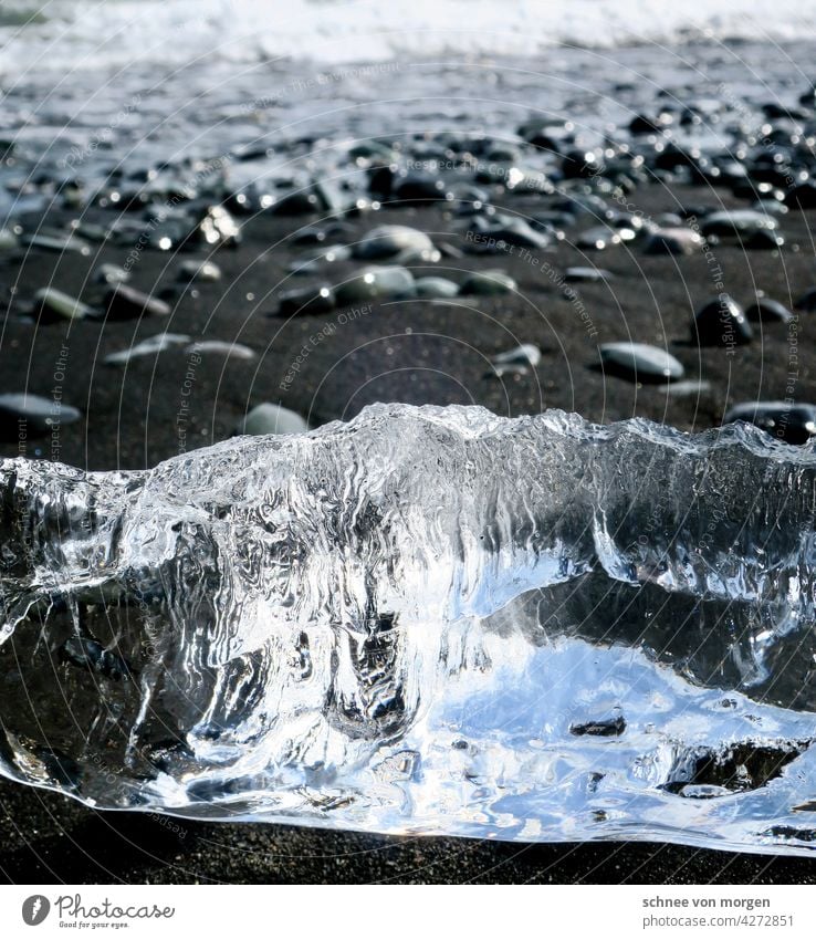Ice chunks on the black beach Ocean Beach Sand Black Iceland Nature Cold stones coast Landscape Water Waves Deserted Exterior shot Day Vacation & Travel Horizon