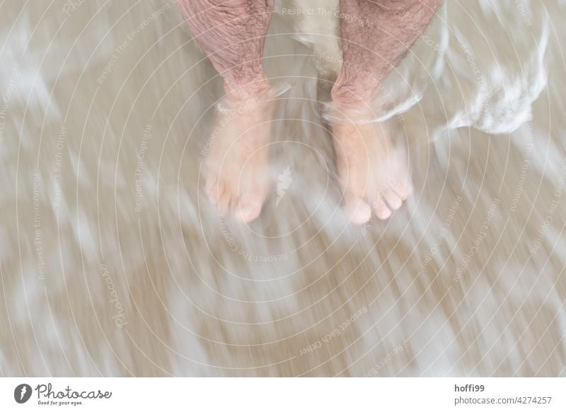 washed by waves with feet in the water Barefoot washed round Legs Toes Ocean Summer Abstract experimental Feet White crest spray water Waves hazy Human being