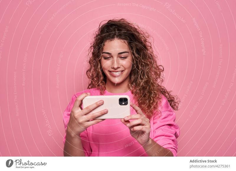 Happy woman taking selfie on smartphone using teen vivid positive internet digital charming female mobile happy take photo casual self portrait cheerful smile
