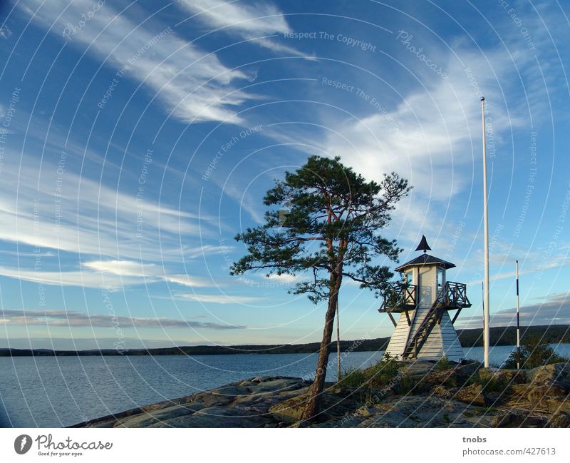 Swedish lighthouse Environment Nature Landscape Air Water Sky Clouds Horizon Summer Beautiful weather Wind Tree Moss Rock Coast Lakeside Fjord Power